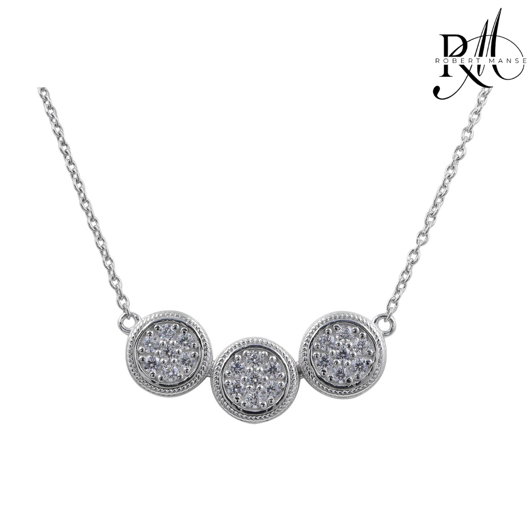 Silver necklace with three round diamond pendants on a white background