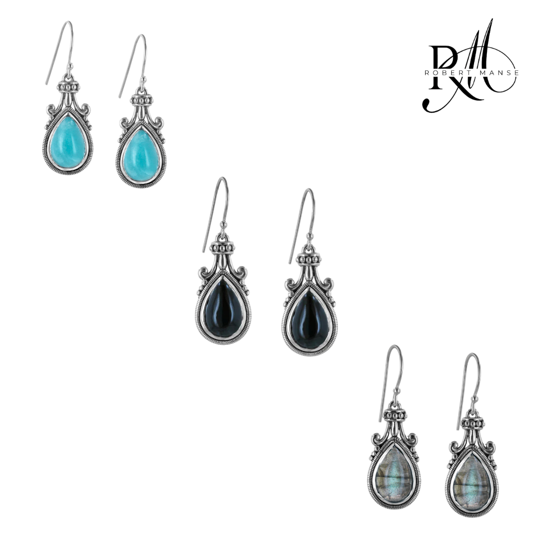 A collection of sterling silver drop earrings with various gemstones, including blue, black, gray, and translucent options, displayed in sets of three pairs.