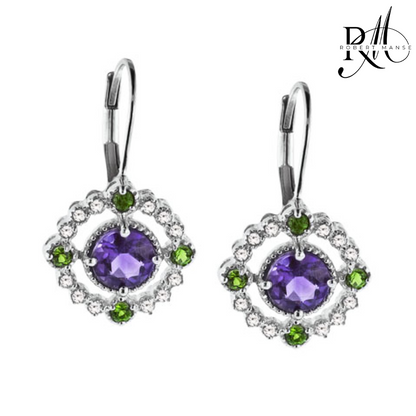 Pair of earrings with purple gemstones and green accents on a white background