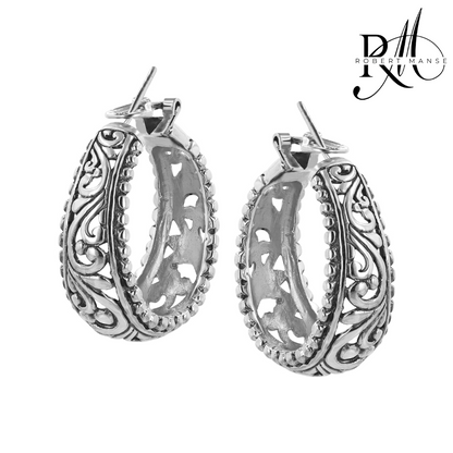 Silver hoop earrings with intricate designs on a white background, featuring the Robert Marne logo.