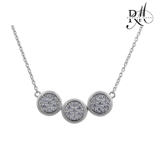 Silver necklace with three round diamond pendants on a white background