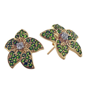 Yellow gold post flower earrings with green gemstones and white zircon center